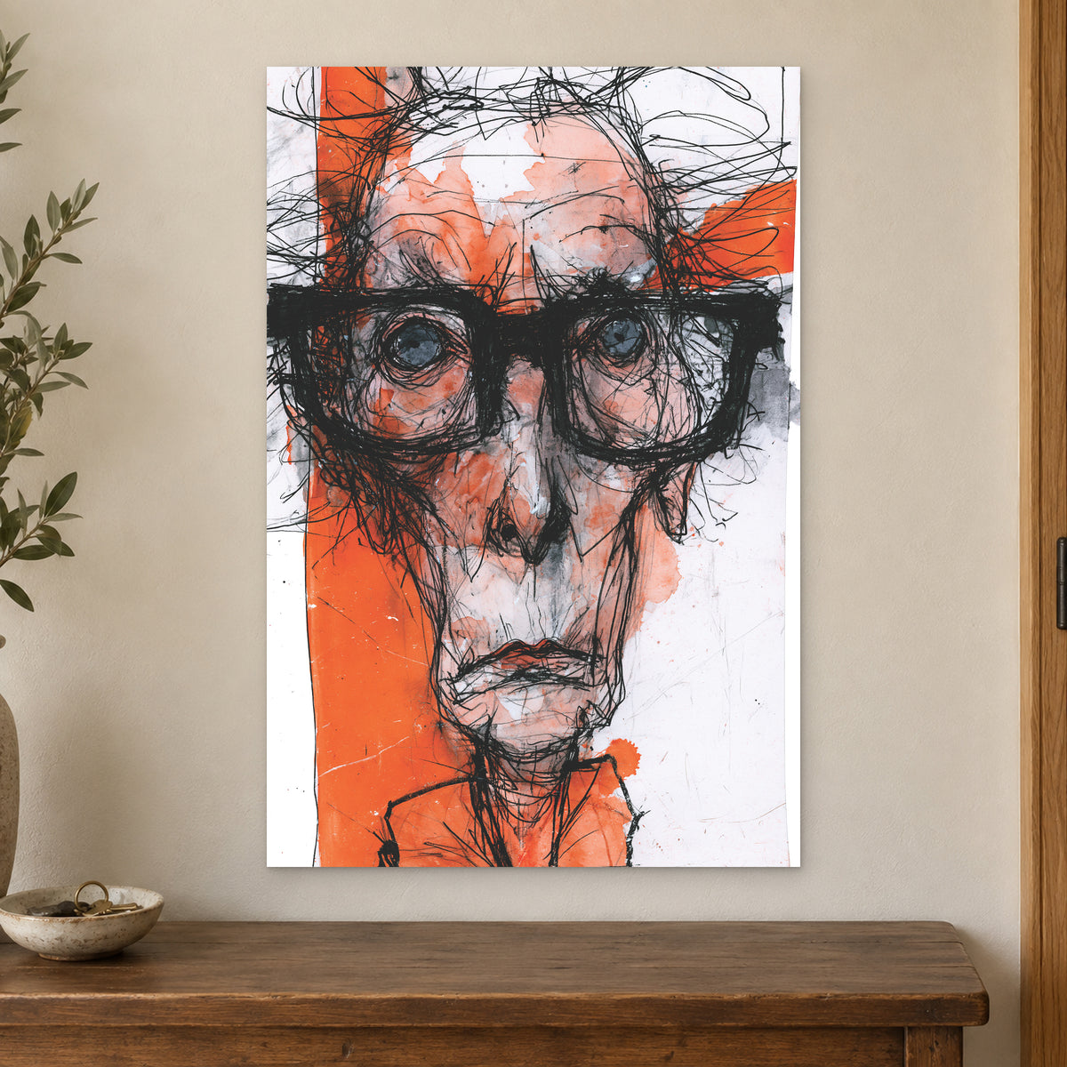Thick Glasses Scribble Portrait canvas wall art on a cream wall above a wooden sideboard beside a door frame