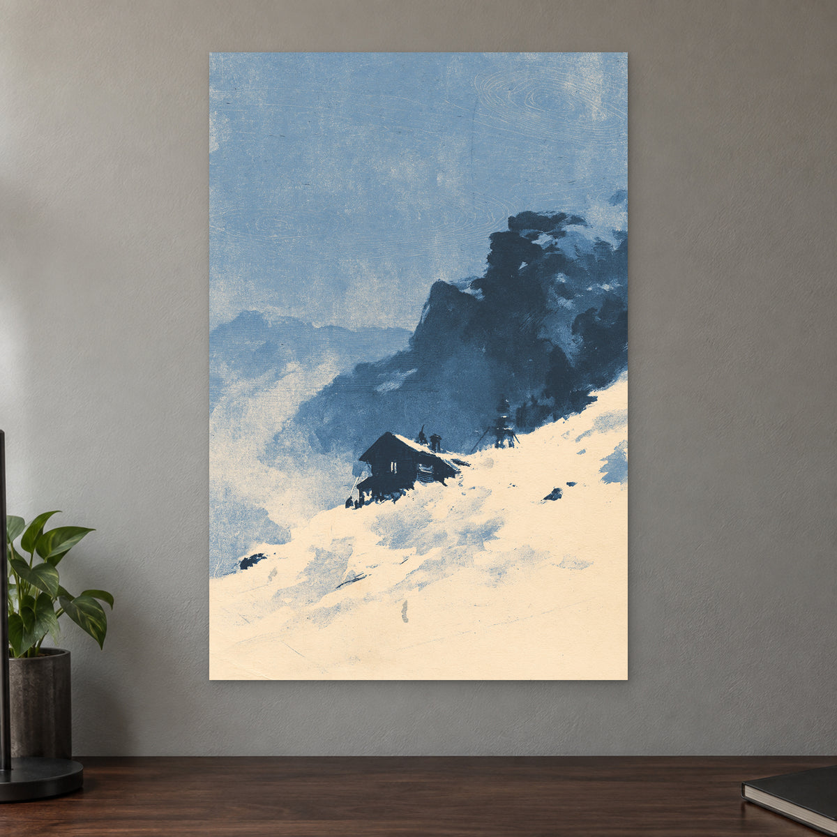 Lone Cabin Snow Slope canvas wall art on a taupe wall above a dark walnut sideboard with a potted plant