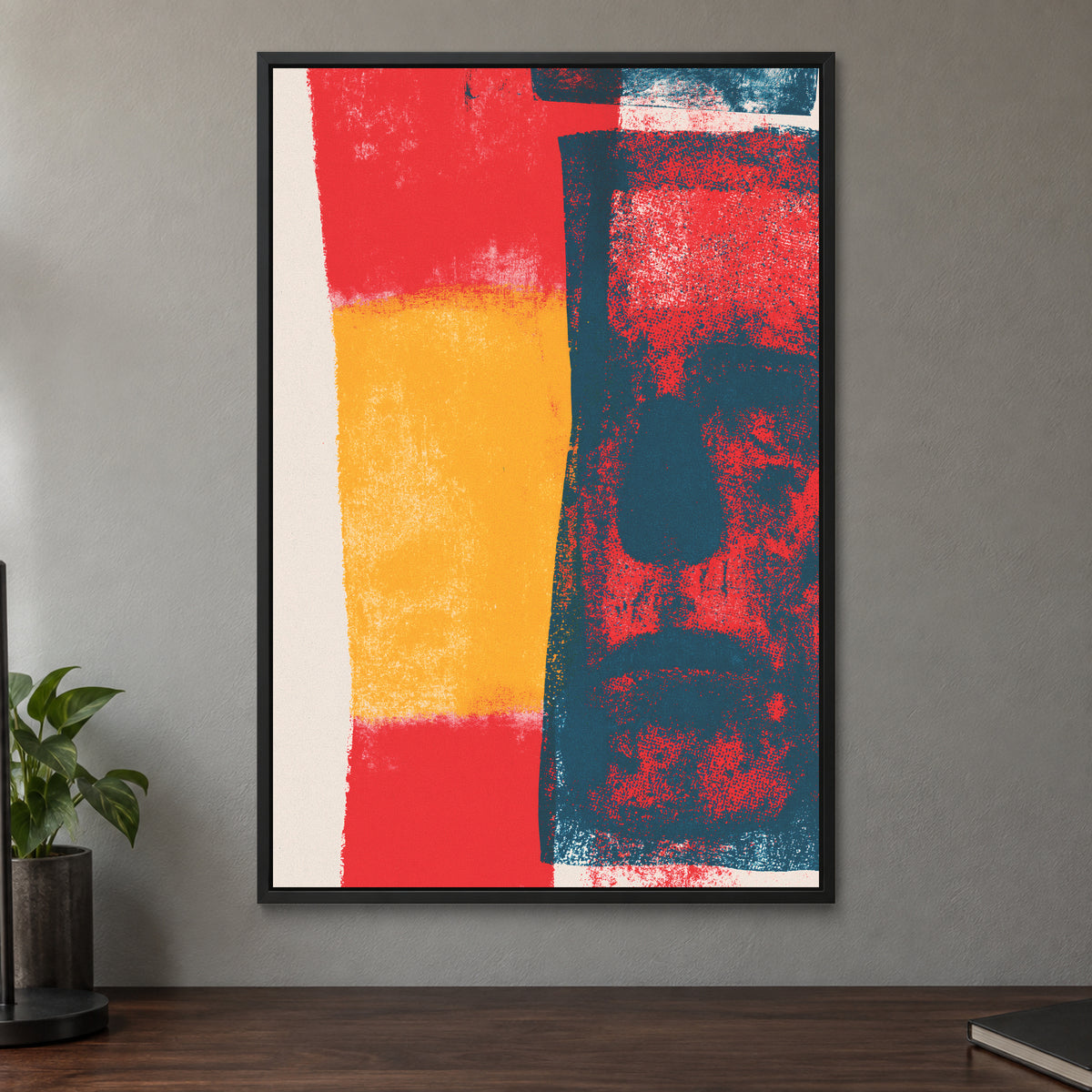 Almost a Face Abstract framed canvas in a black floating frame on a taupe wall above a dark walnut sideboard with a potted plant