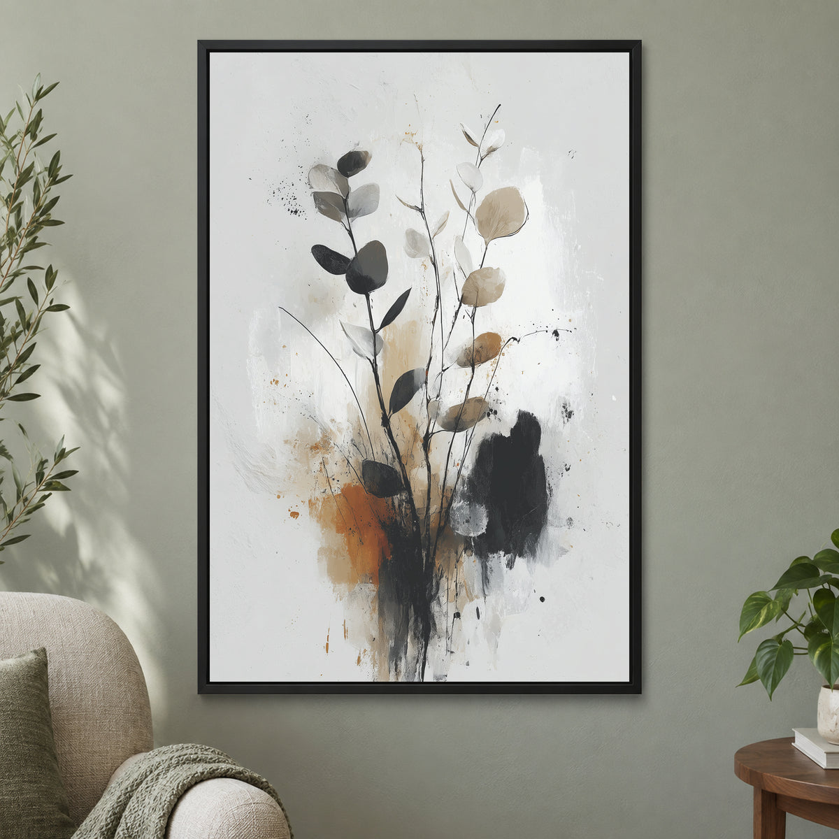 Eucalyptus Stems Minimalist framed canvas in a black floating frame on a sage green wall beside a cream armchair