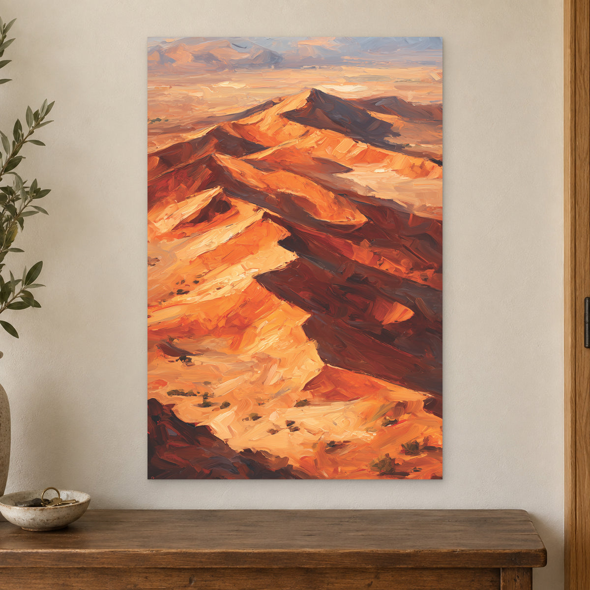 Desert Dunes Aerial Ridge canvas wall art on a cream wall above a wooden sideboard beside a door frame