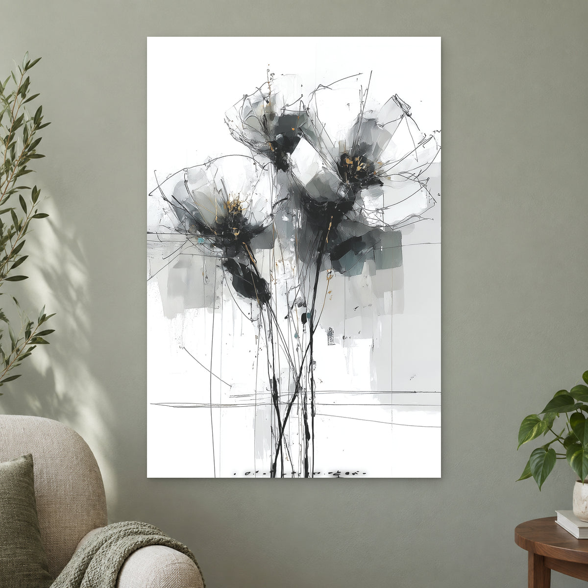 Black and Grey Wildflower Sketch canvas wall art on a sage green wall beside a cream armchair