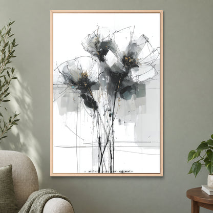Black and Grey Wildflower Sketch framed canvas in a natural wood floating frame on a sage green wall beside a cream armchair