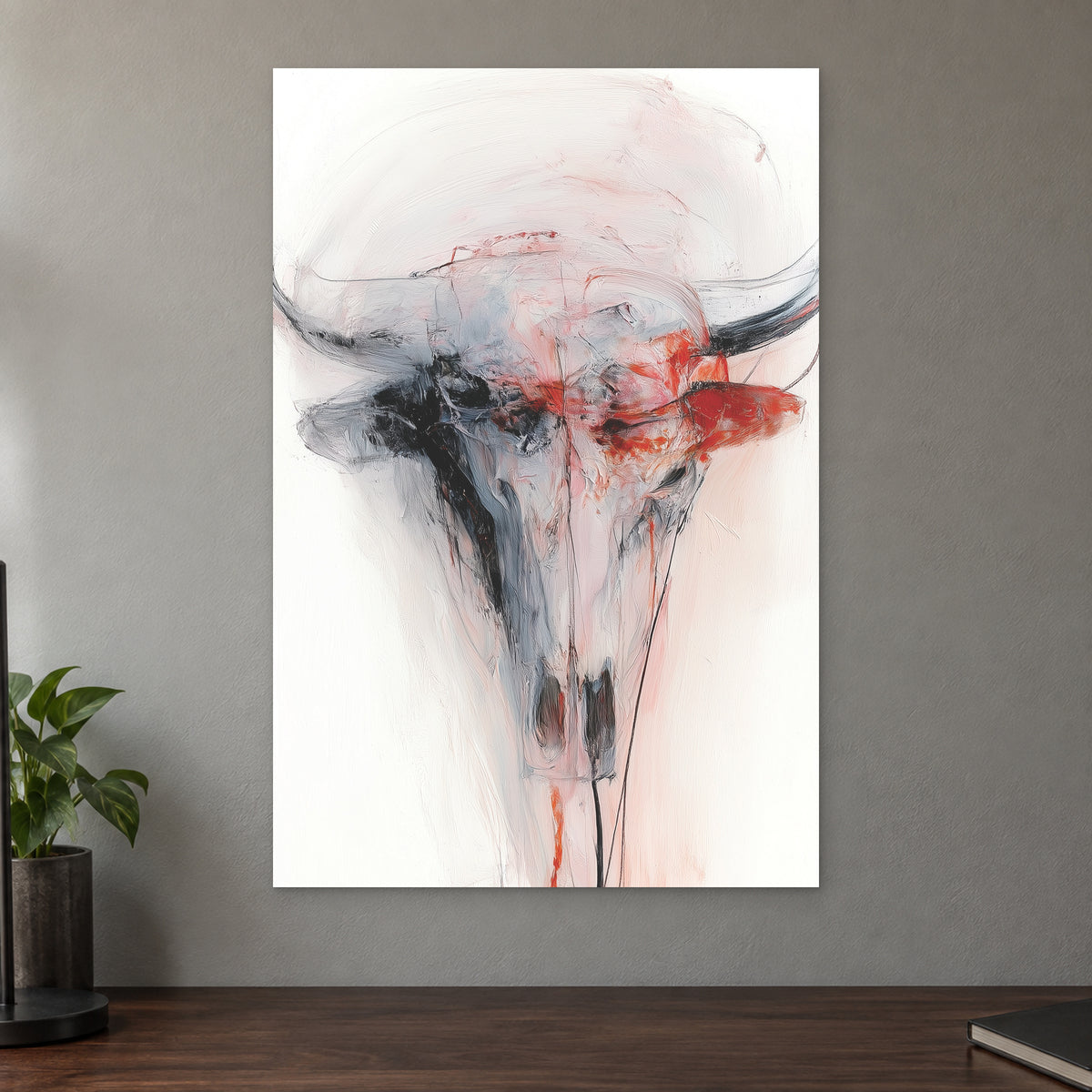 Longhorn Skull in Red and White canvas wall art on a taupe wall above a dark walnut sideboard with a potted plant
