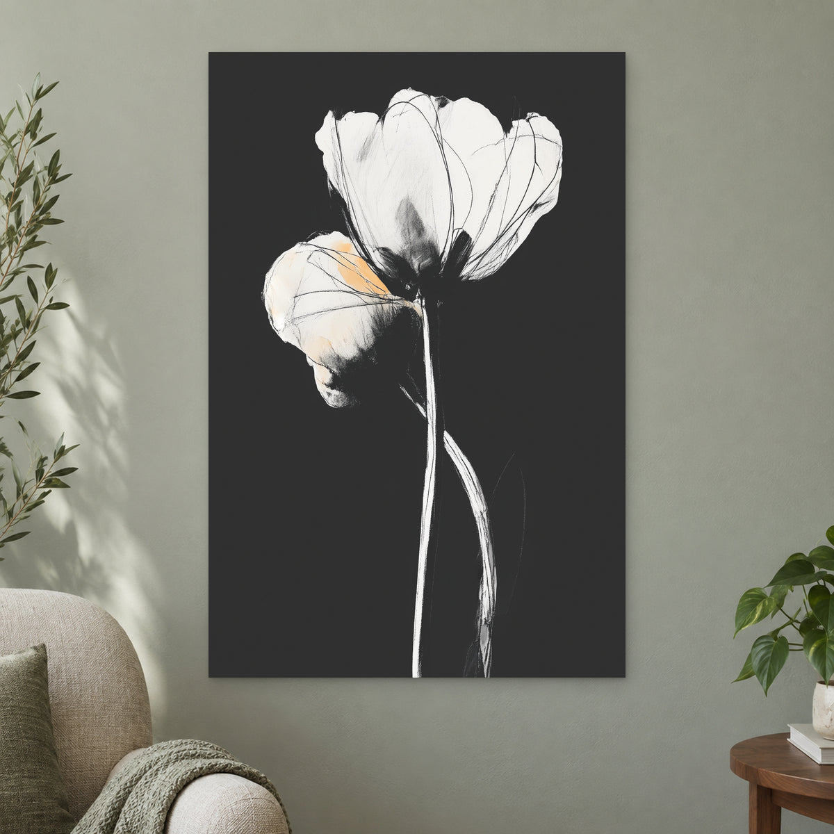 White Tulips on Black canvas wall art on a sage green wall beside a cream armchair