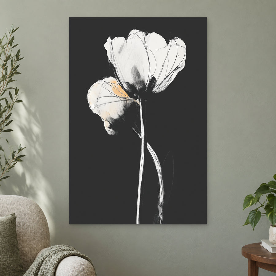 White Tulips on Black canvas wall art on a sage green wall beside a cream armchair