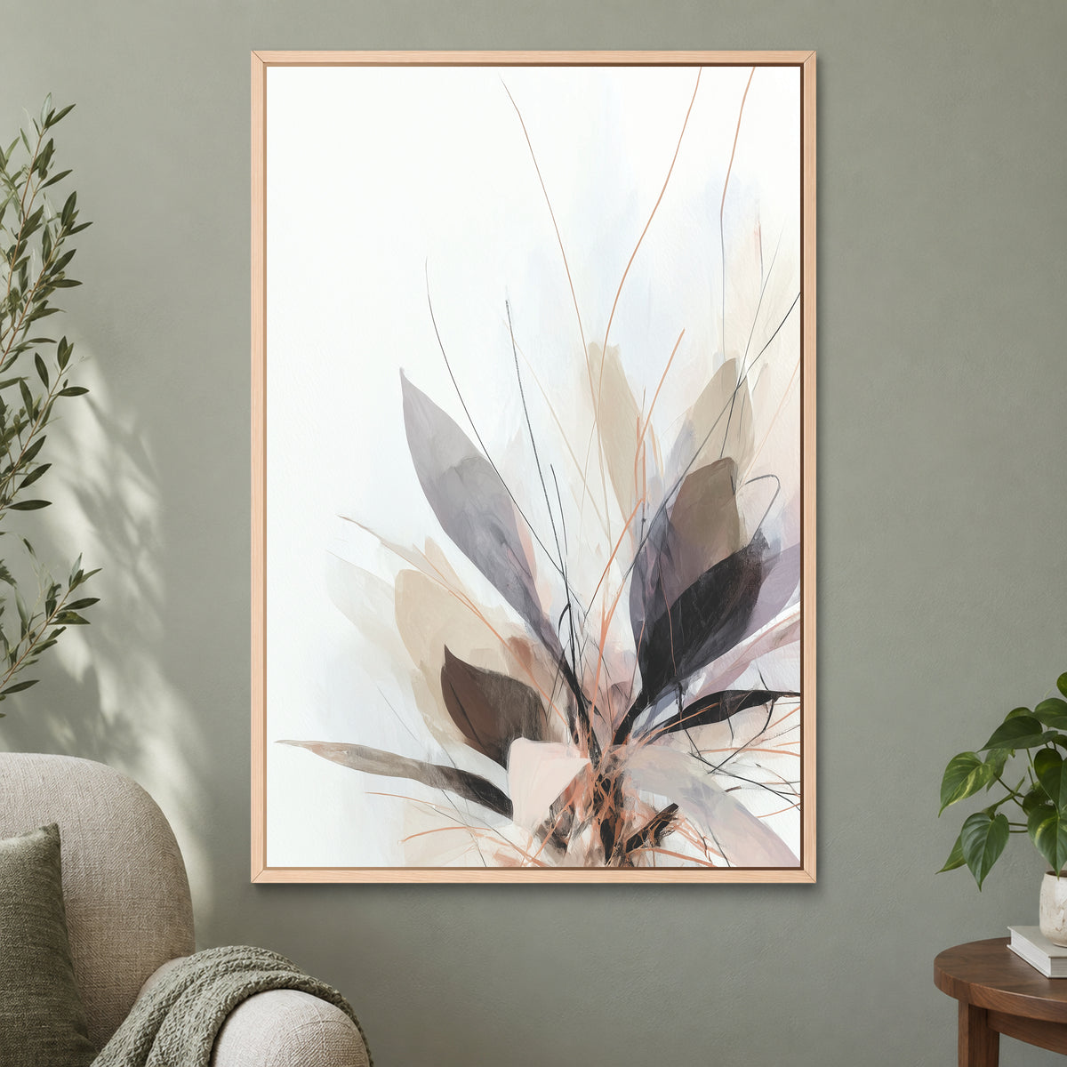 Soft Botanical Sweep Neutral framed canvas in a natural wood floating frame on a sage green wall beside a cream armchair