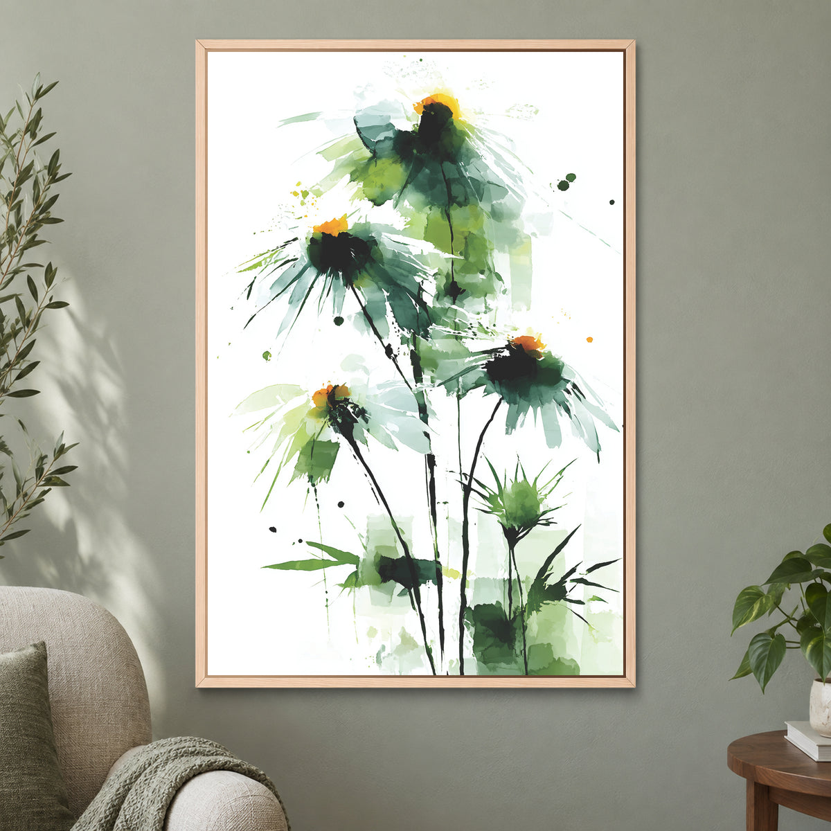 Wild Daisies Botanical Green framed canvas in a natural wood floating frame on a sage green wall beside a cream armchair