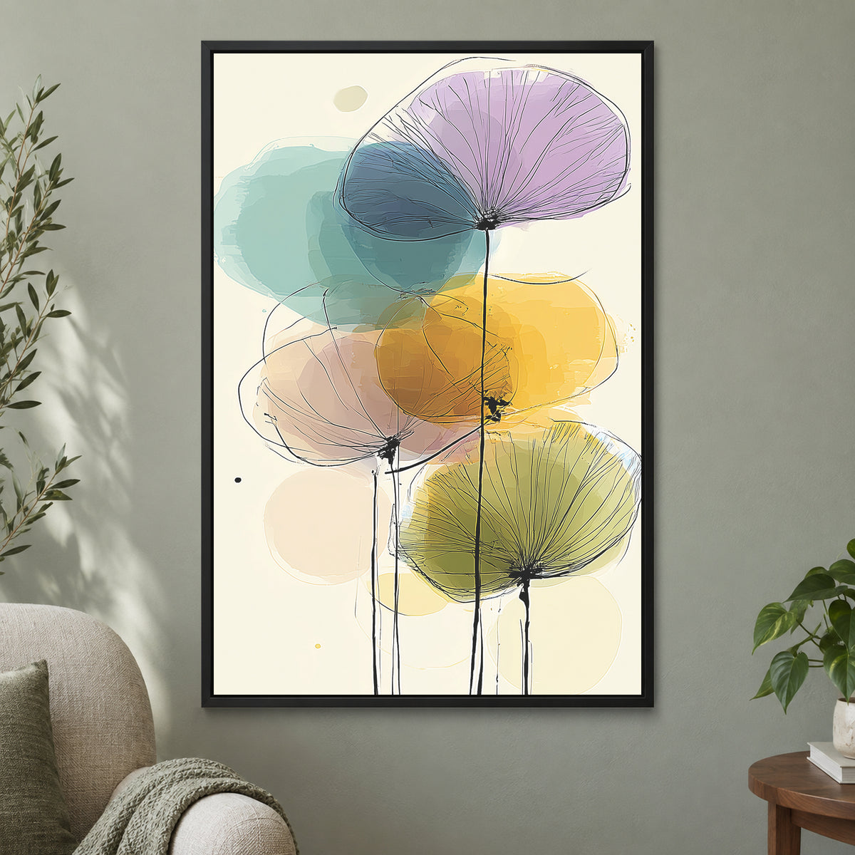 Seed Heads and Soft Circles framed canvas in a black floating frame on a sage green wall beside a cream armchair
