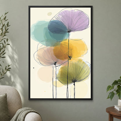 Seed Heads and Soft Circles framed canvas in a black floating frame on a sage green wall beside a cream armchair