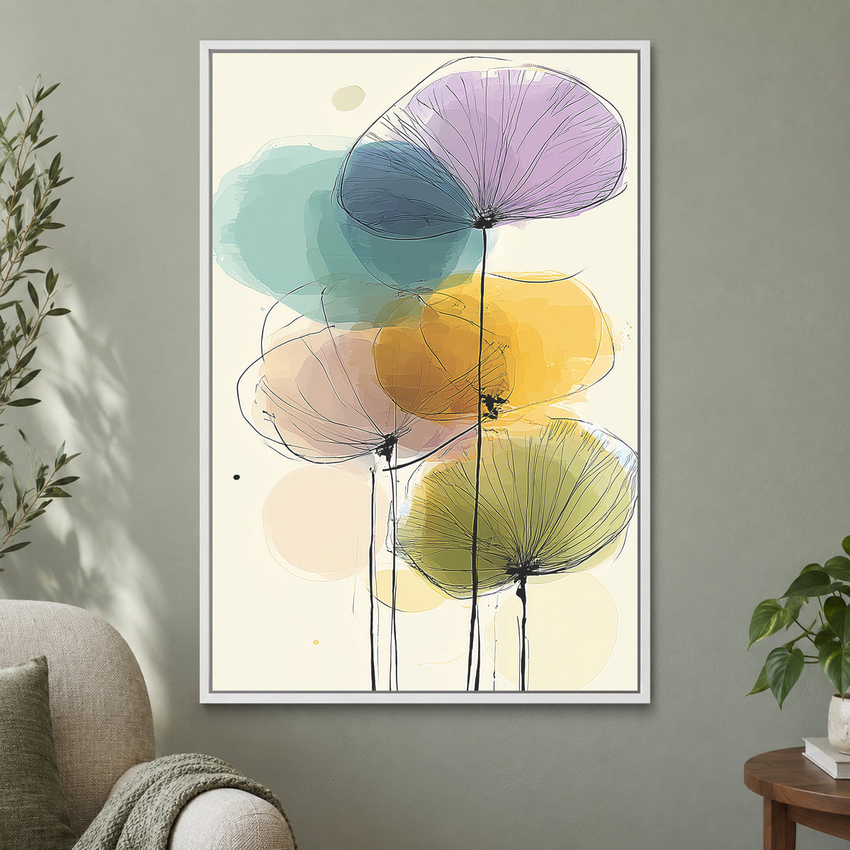 Seed Heads and Soft Circles framed canvas in a white floating frame on a sage green wall beside a cream armchair