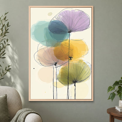 Seed Heads and Soft Circles framed canvas in a natural wood floating frame on a sage green wall beside a cream armchair
