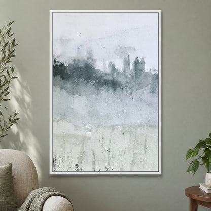 Misty Treeline Minimalist framed canvas in a white floating frame on a sage green wall beside a cream armchair