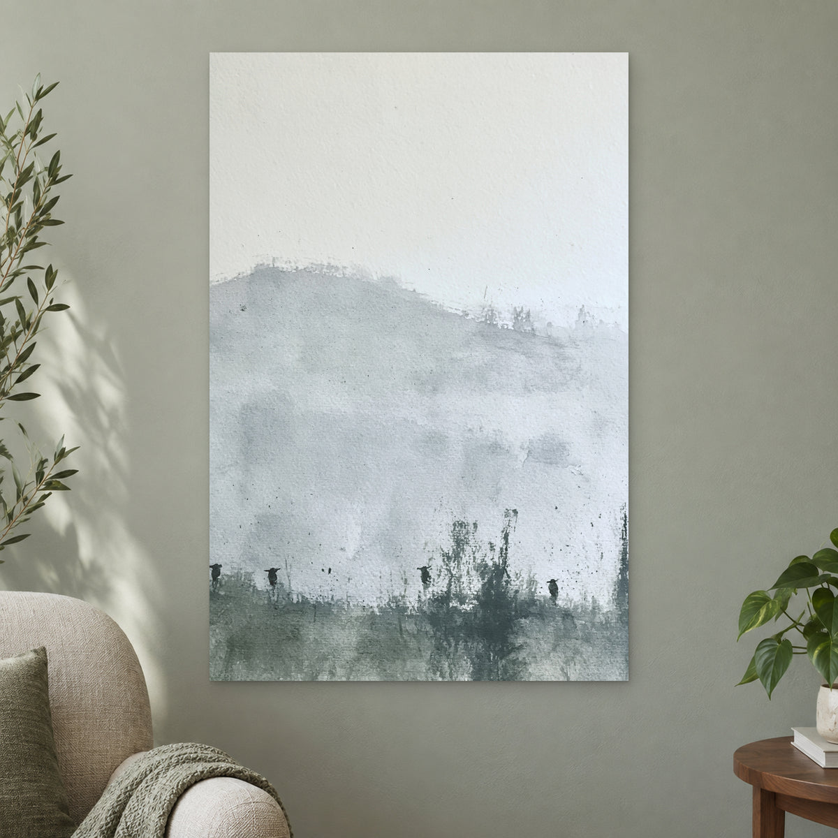 Posts Along the Hedgerow canvas wall art on a sage green wall beside a cream armchair