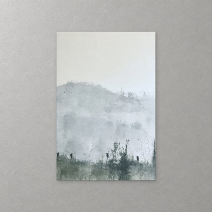 A low grey hill fades into mist above a dark hedgerow and a row of small posts, in soft grey and green washes — canvas wall art print
