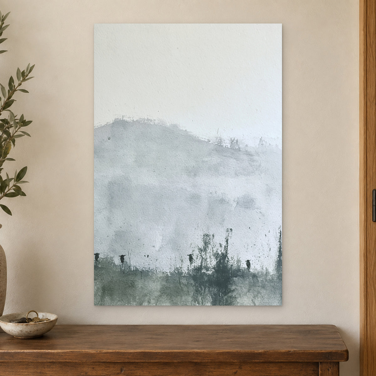Posts Along the Hedgerow canvas wall art on a cream wall above a wooden sideboard beside a door frame