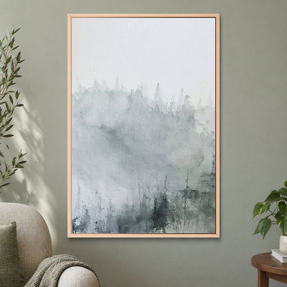 Where the Trees Dissolve framed canvas in a natural wood floating frame on a sage green wall beside a cream armchair