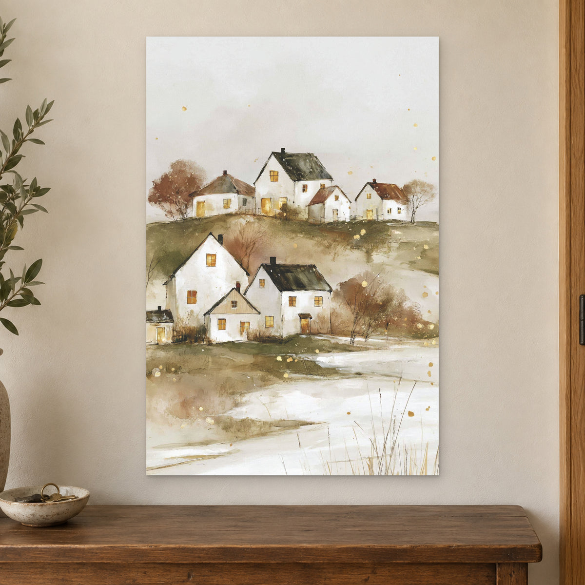 Canadian Prairie Farmhouses Winter canvas wall art on a cream wall above a wooden sideboard beside a door frame