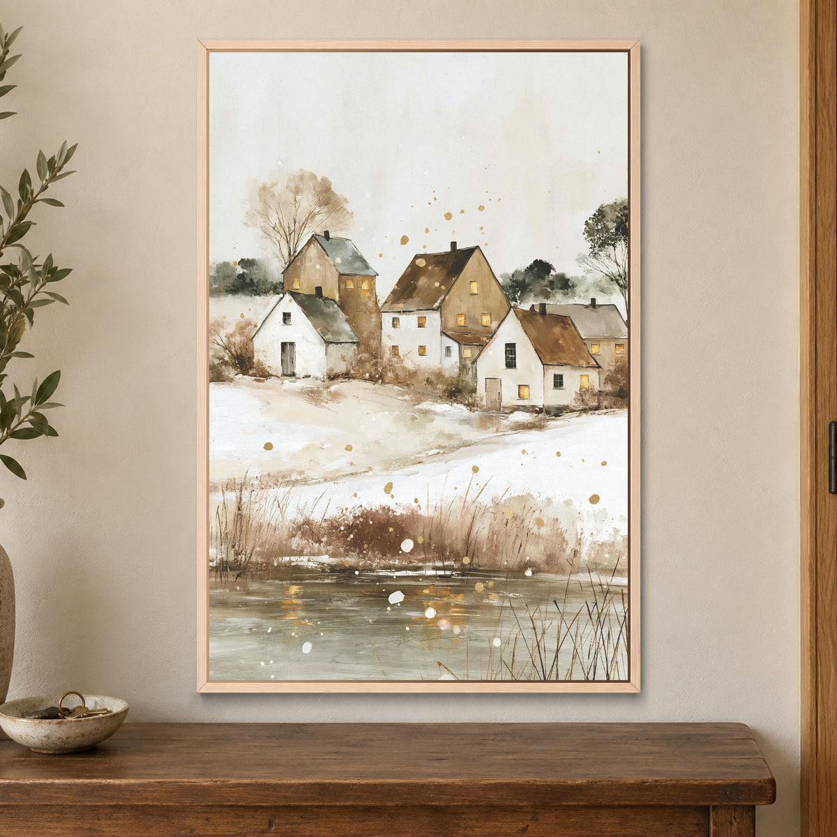 Prairie Farmhouse Frozen Lake framed canvas in a natural wood floating frame on a cream wall above a wooden sideboard beside a door frame