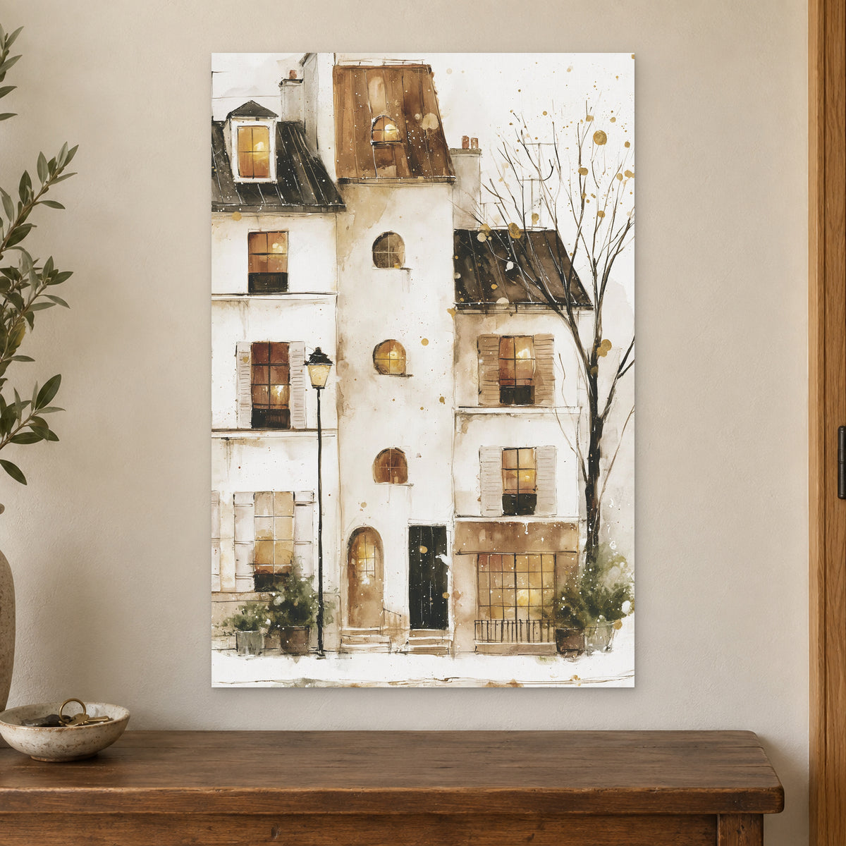 Snowy Paris Windows Watercolour canvas wall art on a cream wall above a wooden sideboard beside a door frame