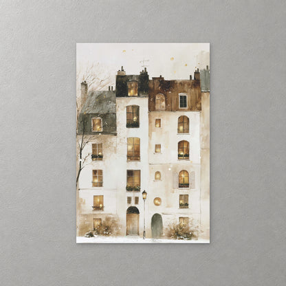Snow falls over a tall white Paris building with rows of warm lit windows, dark rooftops and a single street lamp at its door — canvas wall art print