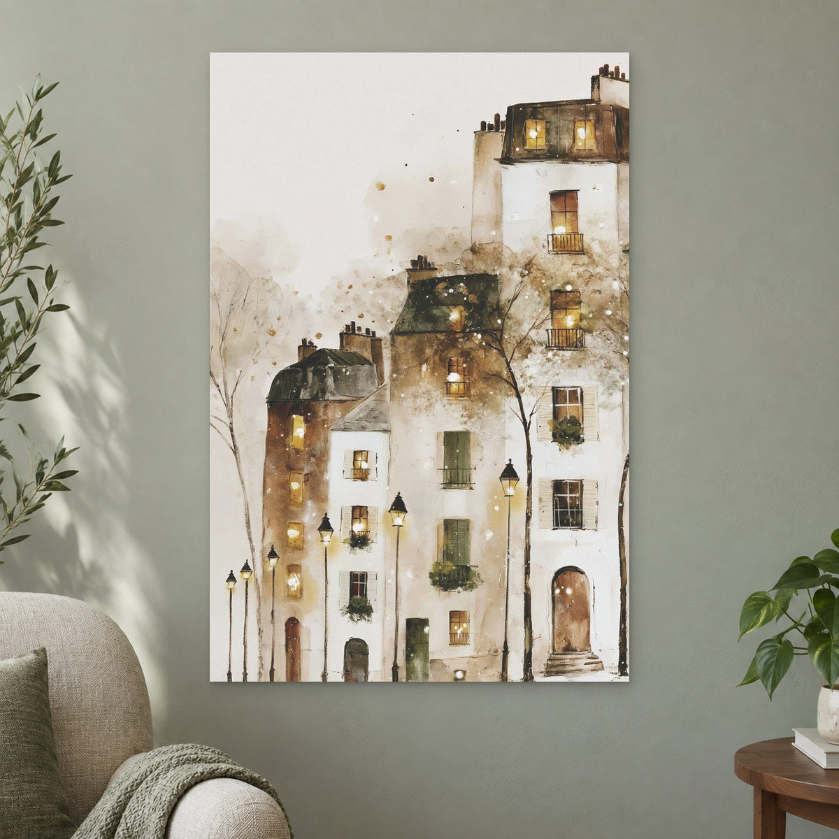 Paris Rooftops in the Snow canvas wall art on a sage green wall beside a cream armchair