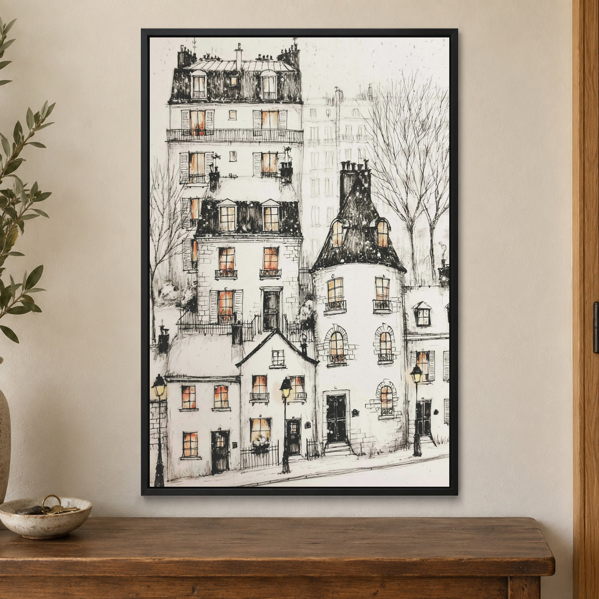 Paris Corner Pen and Ink framed canvas in a black floating frame on a cream wall above a wooden sideboard beside a door frame
