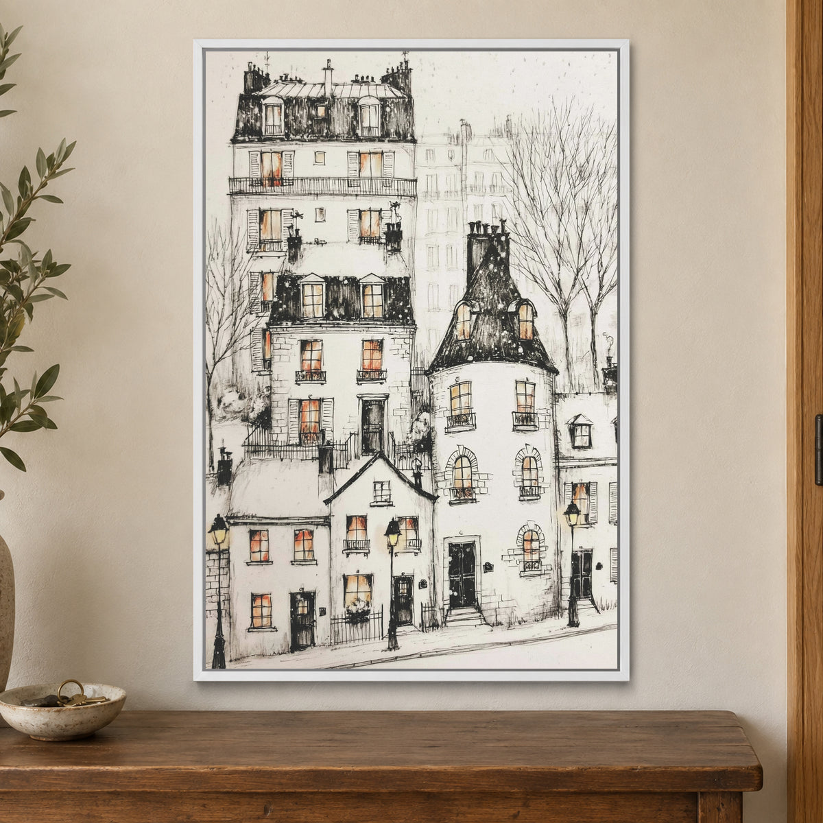Paris Corner Pen and Ink framed canvas in a white floating frame on a cream wall above a wooden sideboard beside a door frame