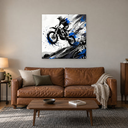 Motocross Airborne Ink canvas wall art above a cognac leather sofa with a wooden coffee table