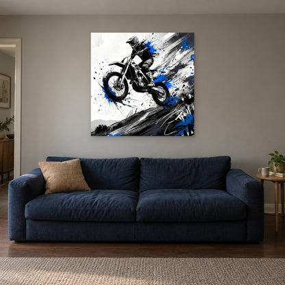 Motocross Airborne Ink canvas wall art above a navy sofa in a living room