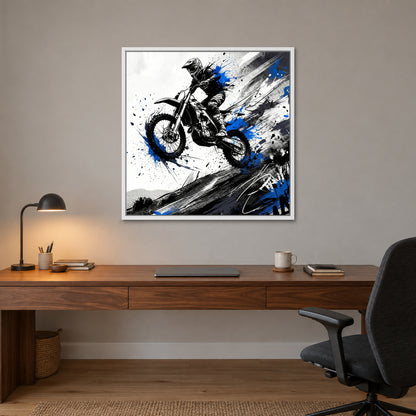 Motocross Airborne Ink framed canvas in a white floating frame above a walnut desk with a brass lamp in a home office