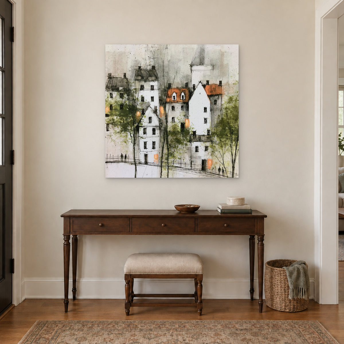 White Gables and Bare Trees canvas wall art above a dark wood console table and upholstered bench in an entryway