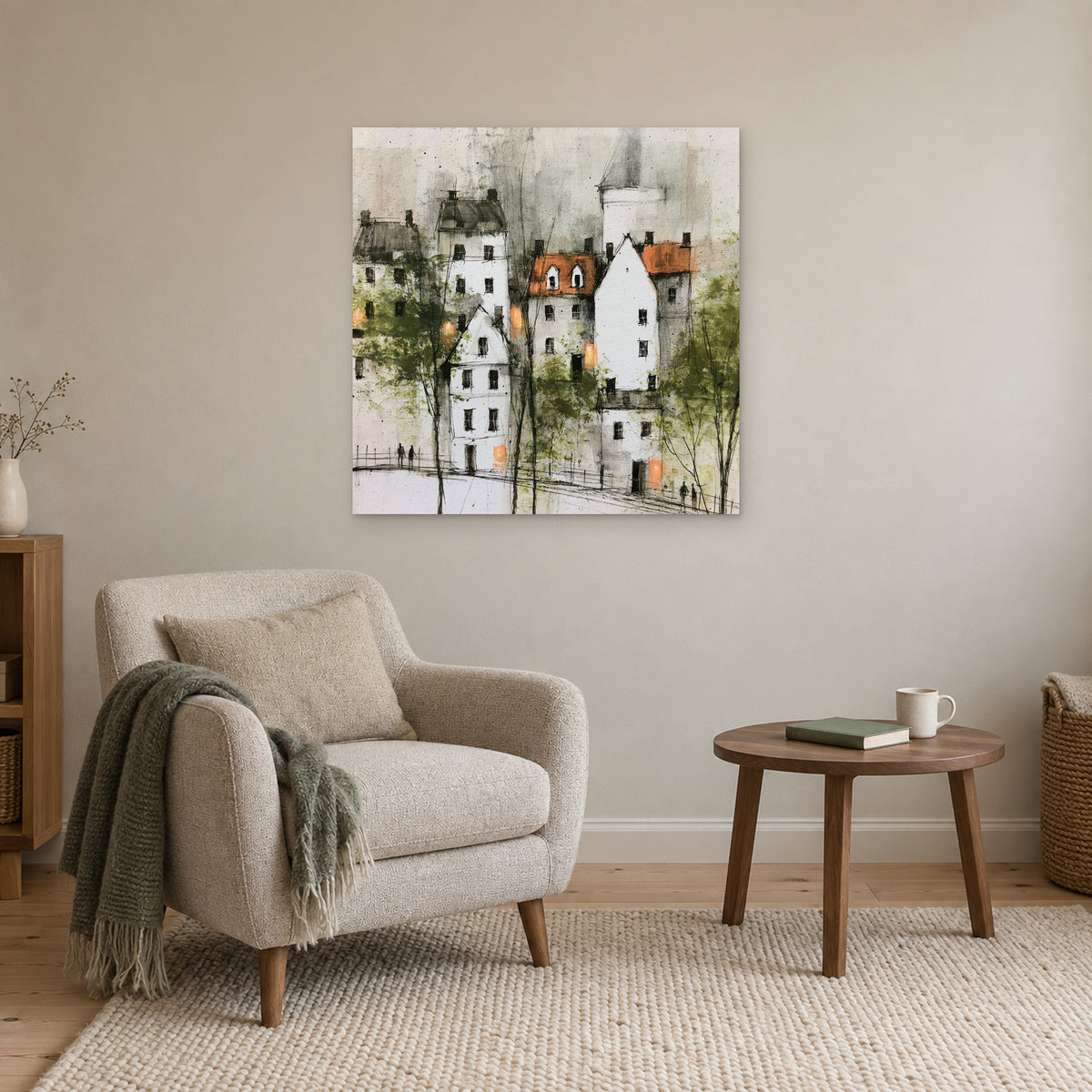 White Gables and Bare Trees canvas wall art above a cream armchair and round wooden side table