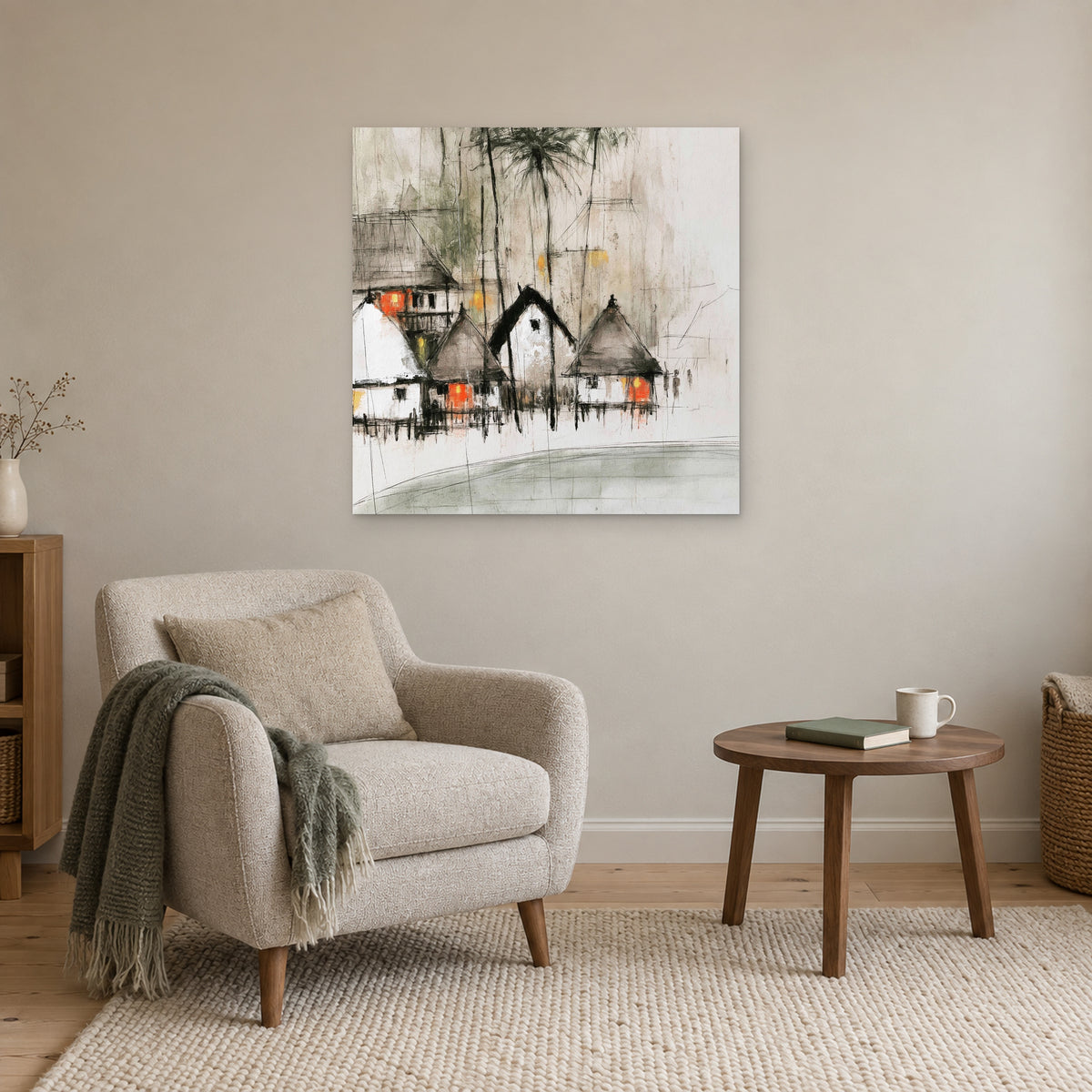 Stilt Huts and Running Ink canvas wall art above a cream armchair and round wooden side table