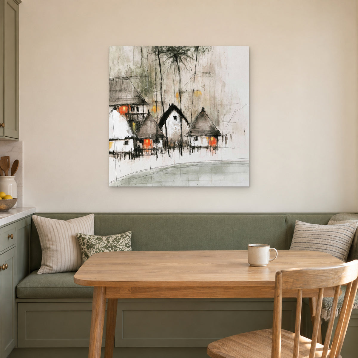 Stilt Huts and Running Ink canvas wall art above a green banquette and wooden table in a breakfast nook