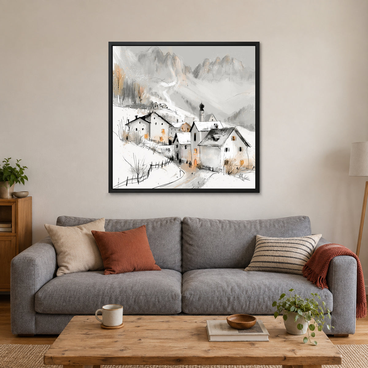 Dolomites Onion Dome Chalets framed canvas in a black floating frame above a grey sofa with rust and striped cushions