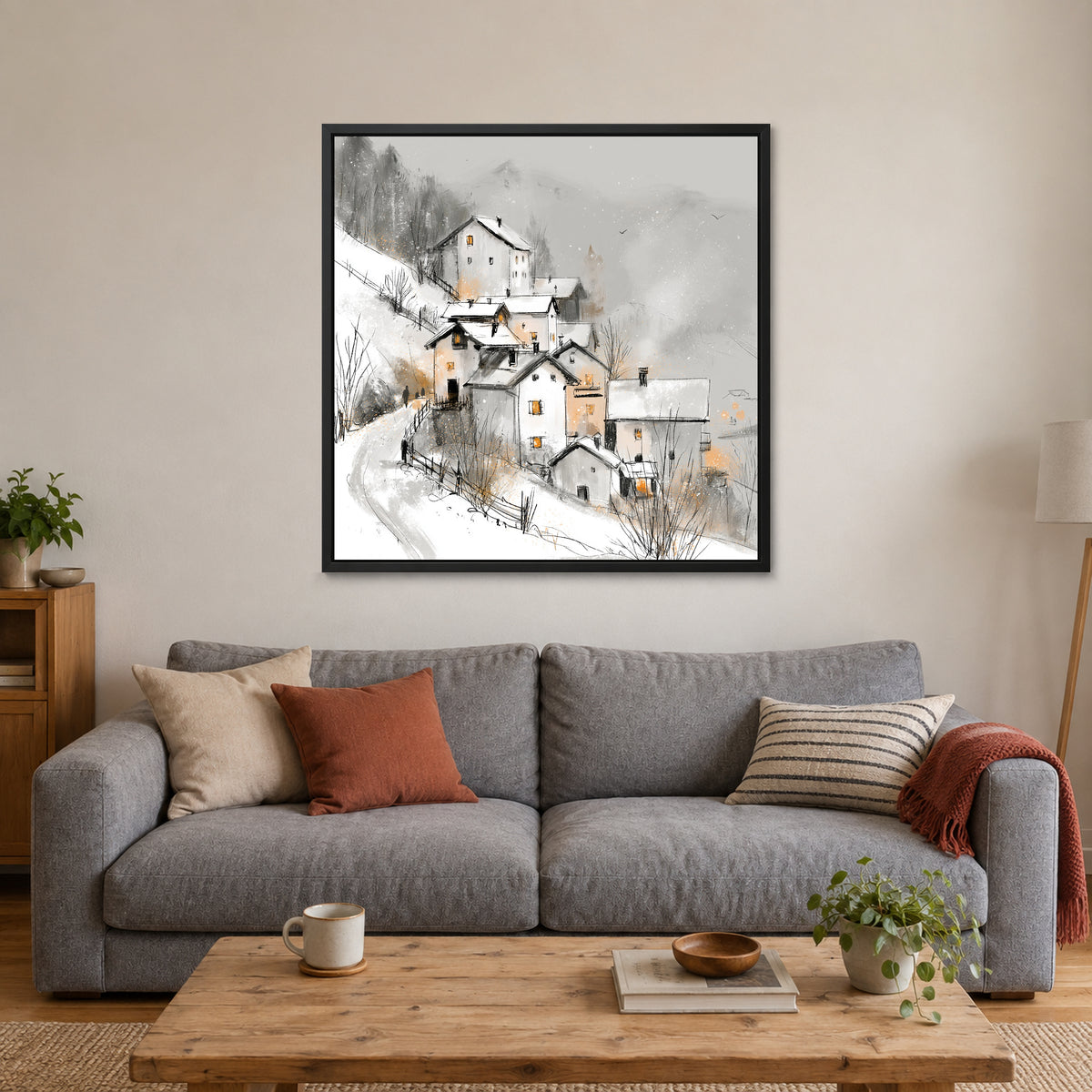 Dolomites Road and Lake framed canvas in a black floating frame above a grey sofa with rust and striped cushions