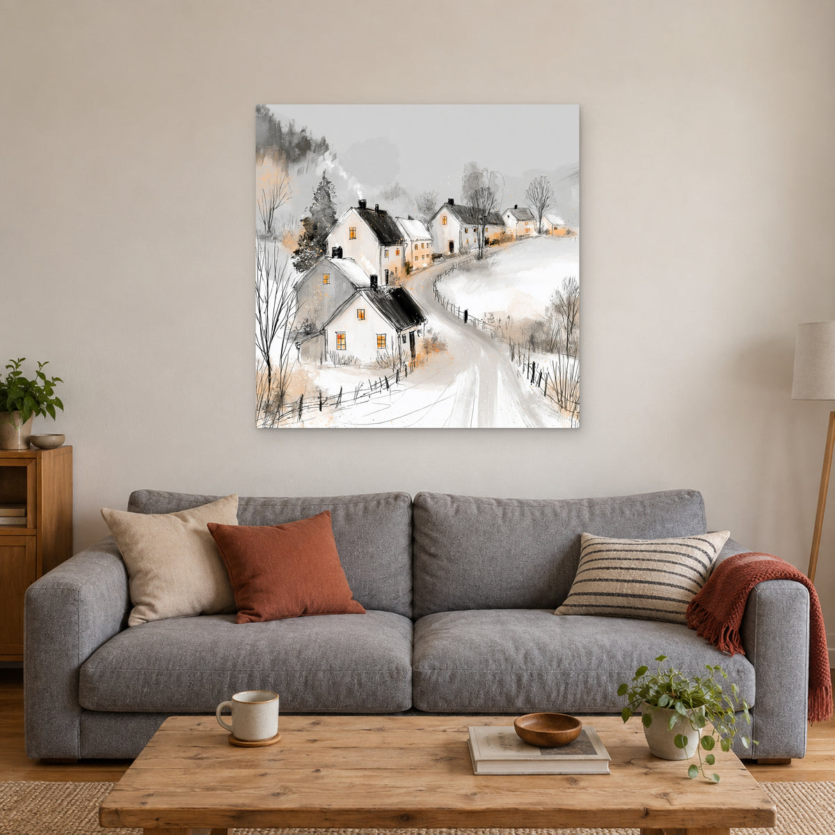 The Lane Home in Winter canvas wall art above a grey sofa with rust and striped cushions