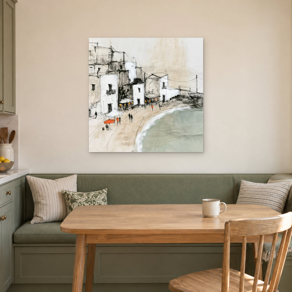 Whitewashed Seaside Village canvas wall art above a green banquette and wooden table in a breakfast nook