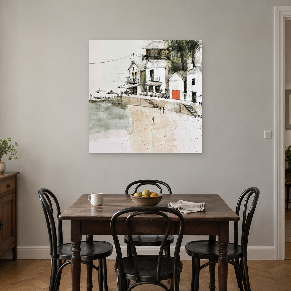 The Orange Door canvas wall art above a small wooden dining table with black bentwood chairs