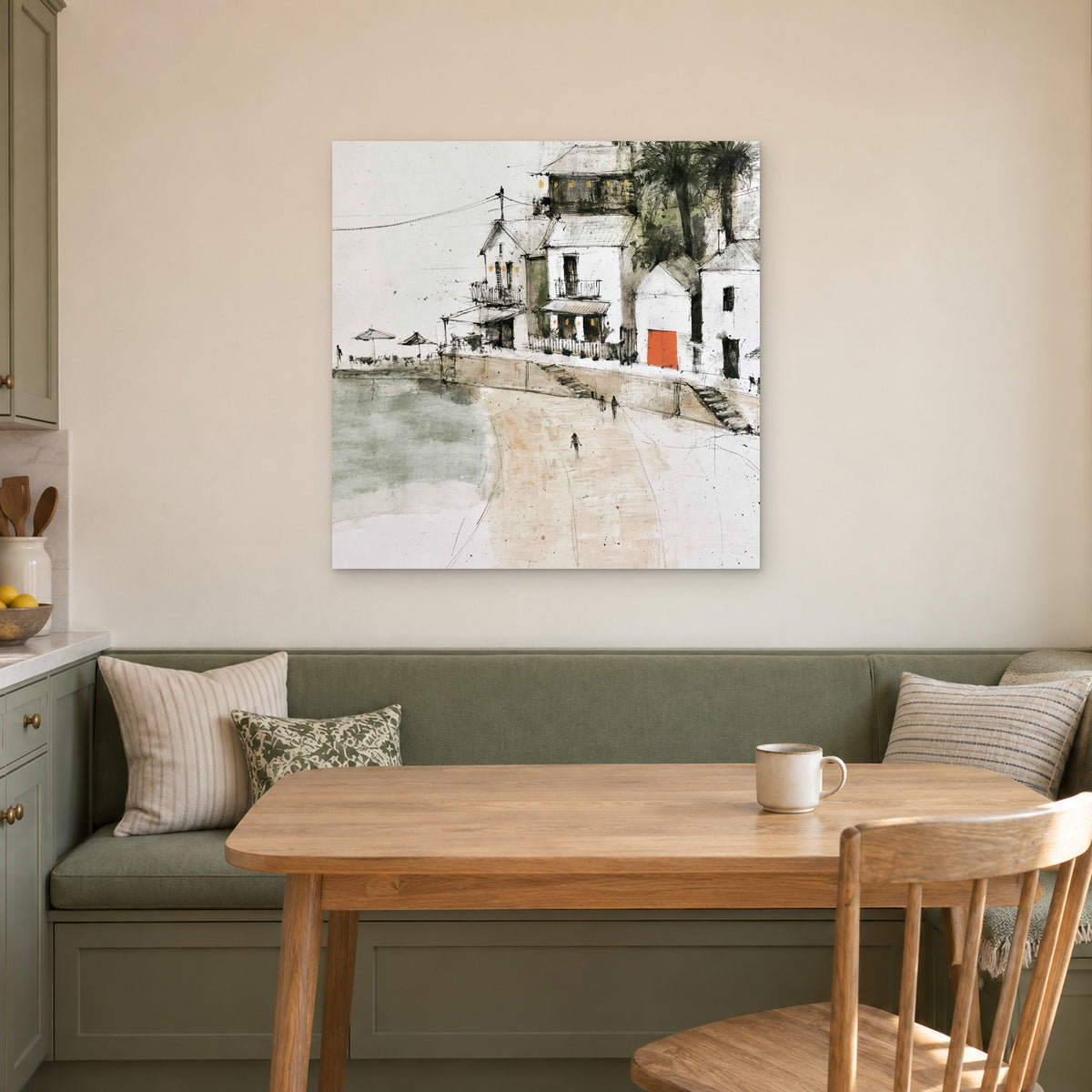 The Orange Door canvas wall art above a green banquette and wooden table in a breakfast nook