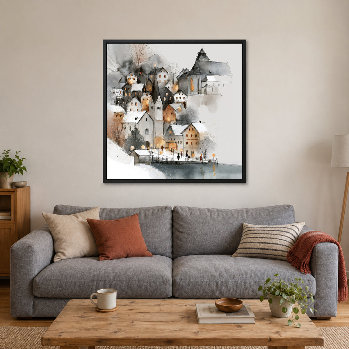Hallstatt Waterfront Clock Tower framed canvas in a black floating frame above a grey sofa with rust and striped cushions