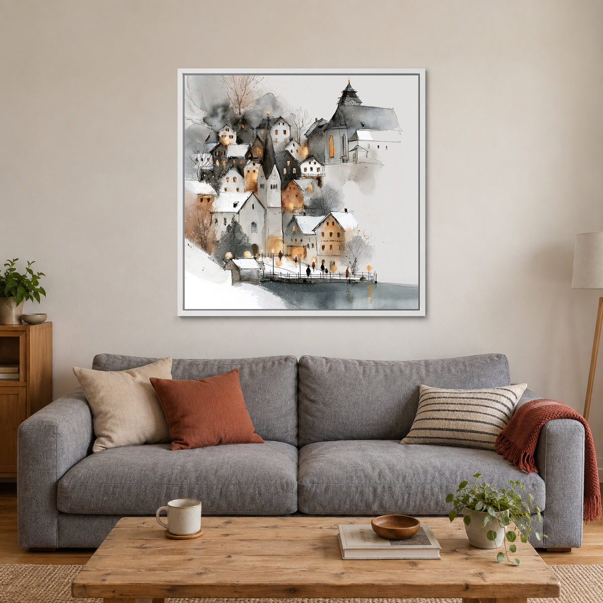 Hallstatt Waterfront Clock Tower framed canvas in a white floating frame above a grey sofa with rust and striped cushions