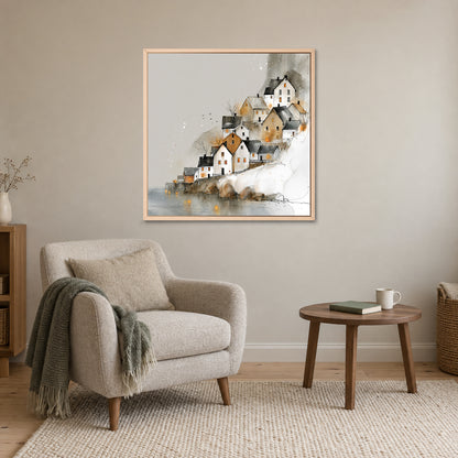 Reine Norway Houses Above Still Water framed canvas in a natural wood floating frame above a cream armchair and round wooden side table