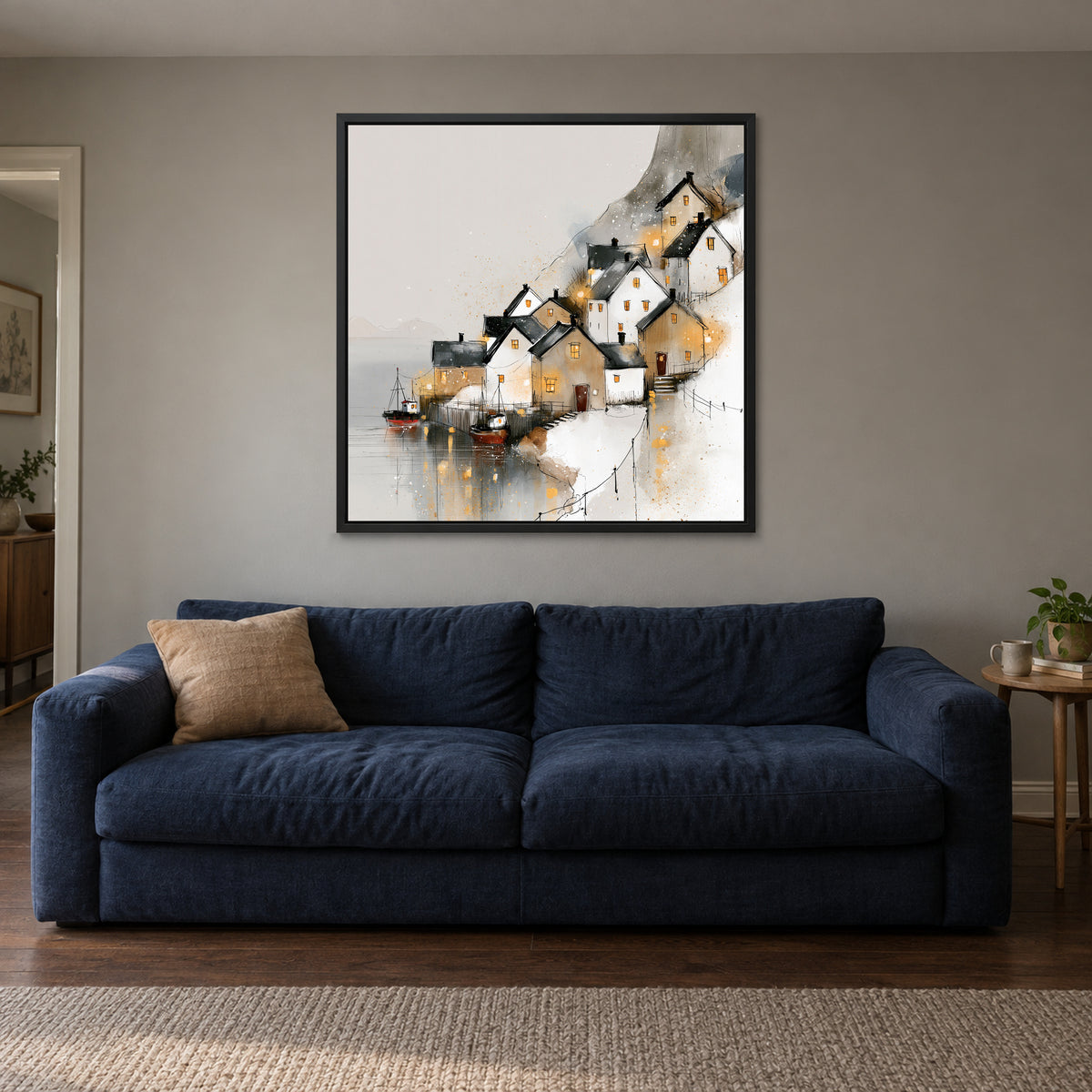 Harbour Lights in the Snow framed canvas in a black floating frame above a navy sofa