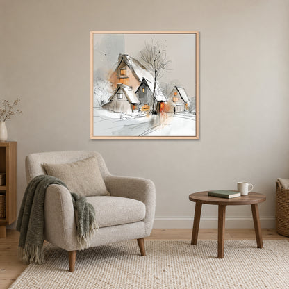 Three Thatched Roofs and a Tree framed canvas in a natural wood floating frame above a cream armchair and round wooden side table