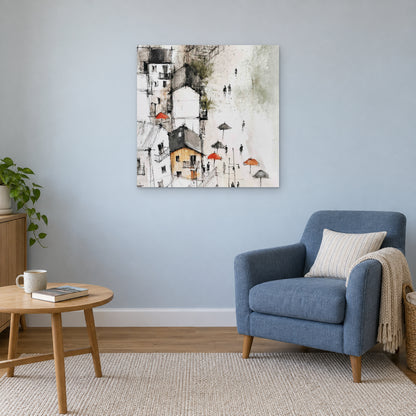 Sicilian Hill Town Pen and Wash canvas wall art above a blue armchair and round wooden side table in a reading corner
