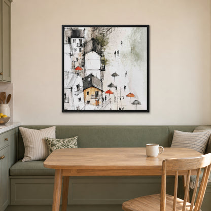 Sicilian Hill Town Pen and Wash framed canvas in a black floating frame above a green banquette and wooden table in a breakfast nook