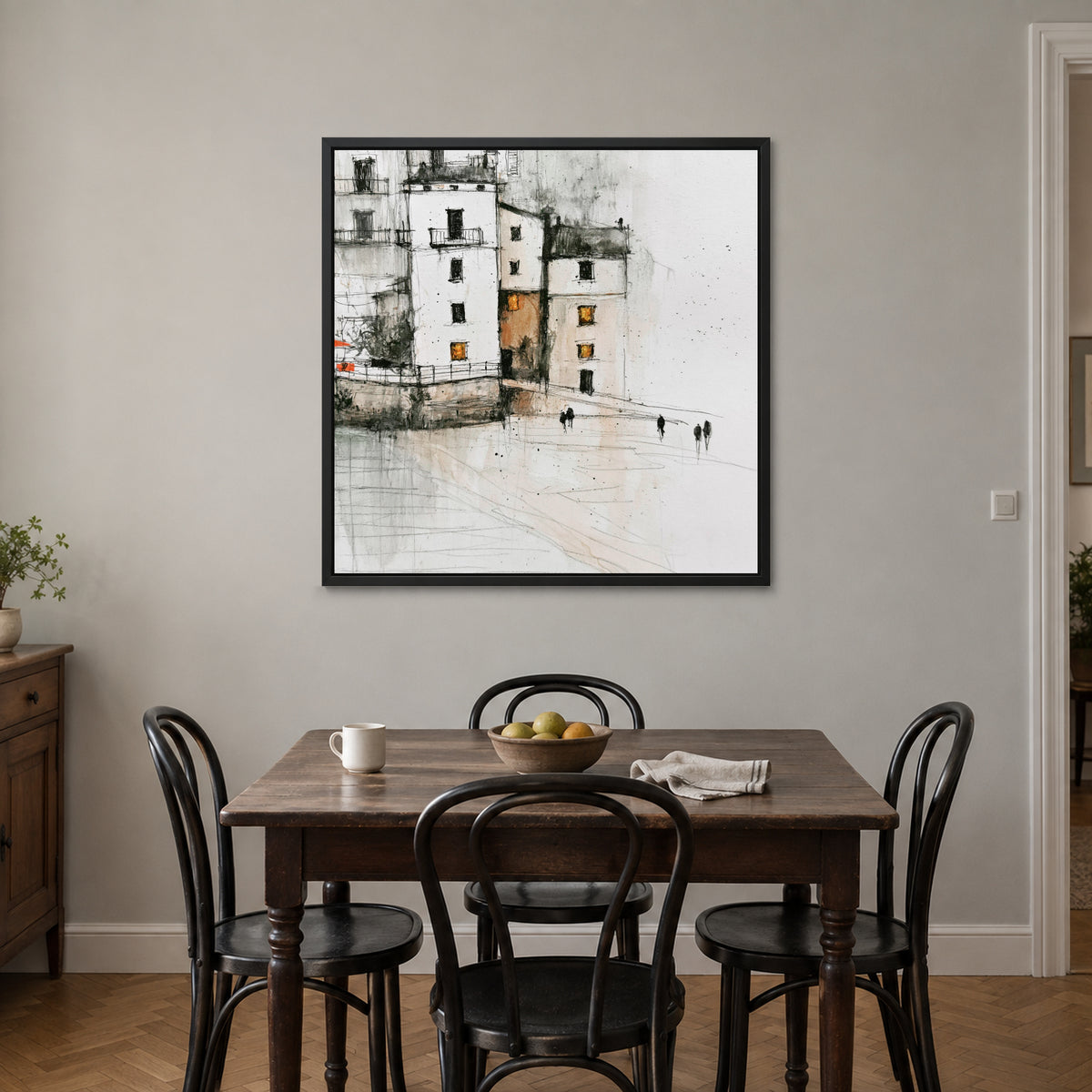 Sicilian Quay in Pencil and Ink framed canvas in a black floating frame above a small wooden dining table with black bentwood chairs