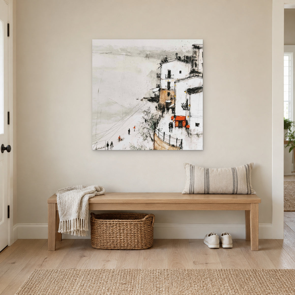 Sicilian Cliff Town Above the Sand canvas wall art above a wooden entryway bench with a woven basket
